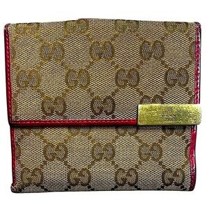 • Gucci canvas and pink leather bifold wallet